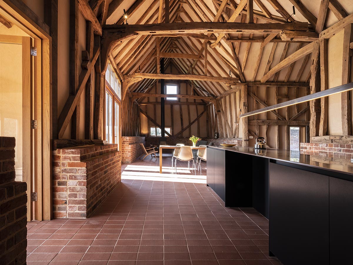 Jankes Barn restored by Lynch Architects uses Staffs red quarry tiles over underfloor heating